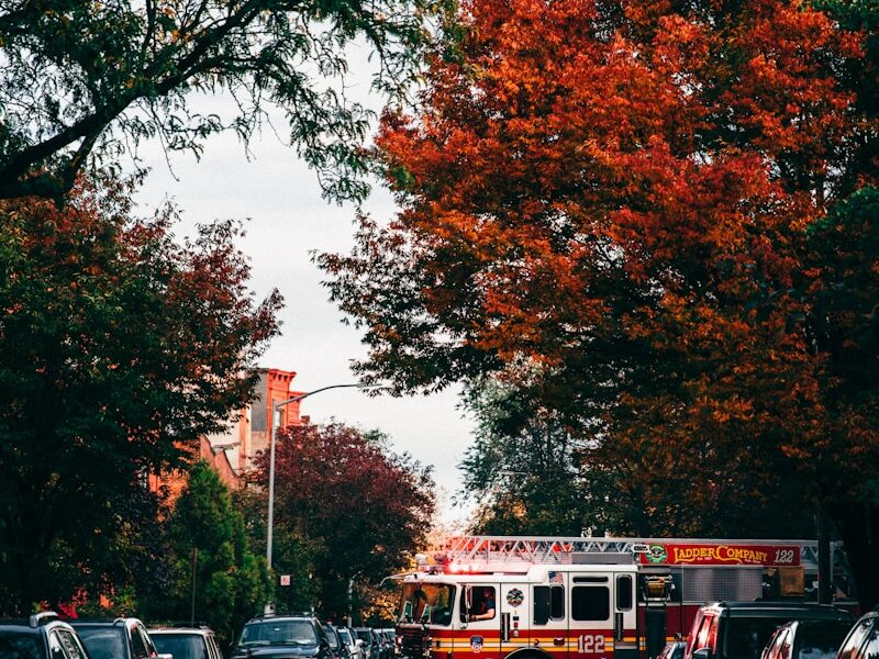 landscape photography of fire engine crossing street