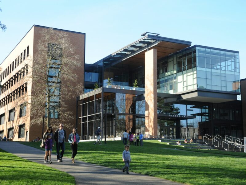 people walking near Paccar Hall University of Washington during daytime