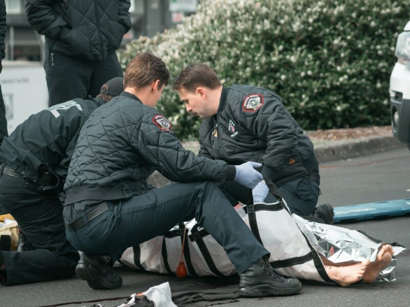 a couple of men that are sitting on the ground